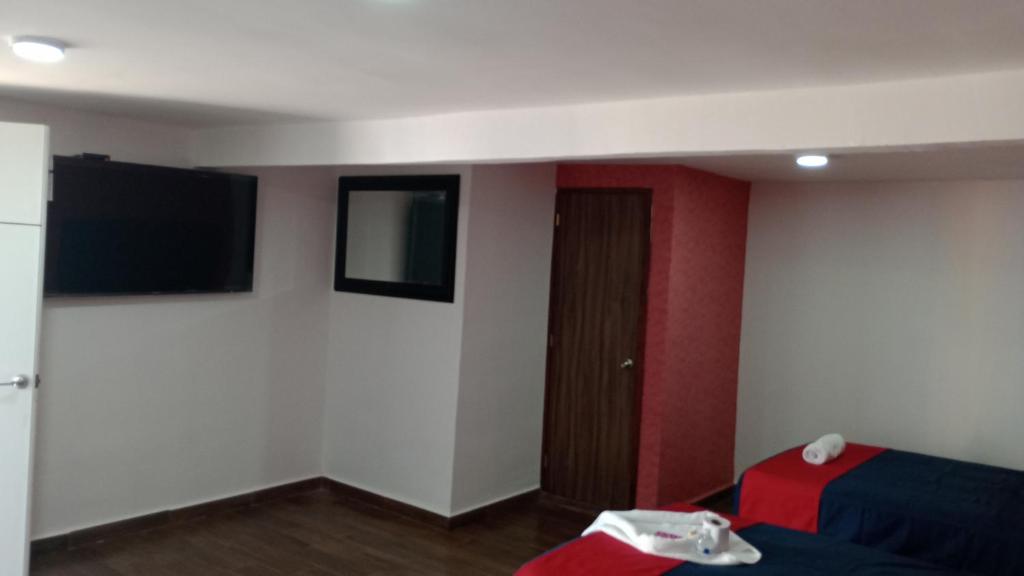 TV a/nebo společenská místnost v ubytování Hotel La Intimidad