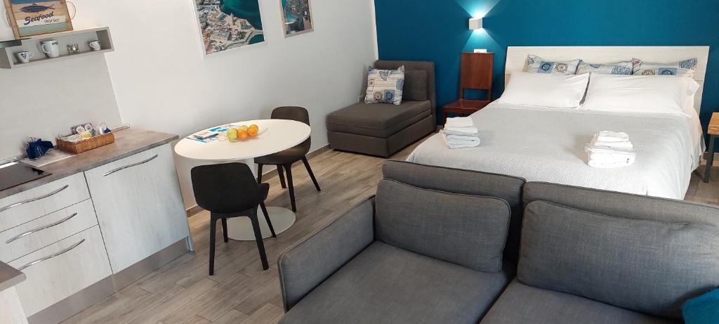 Postel nebo postele na pokoji v ubytování TRANI LA GRAZIA b&b