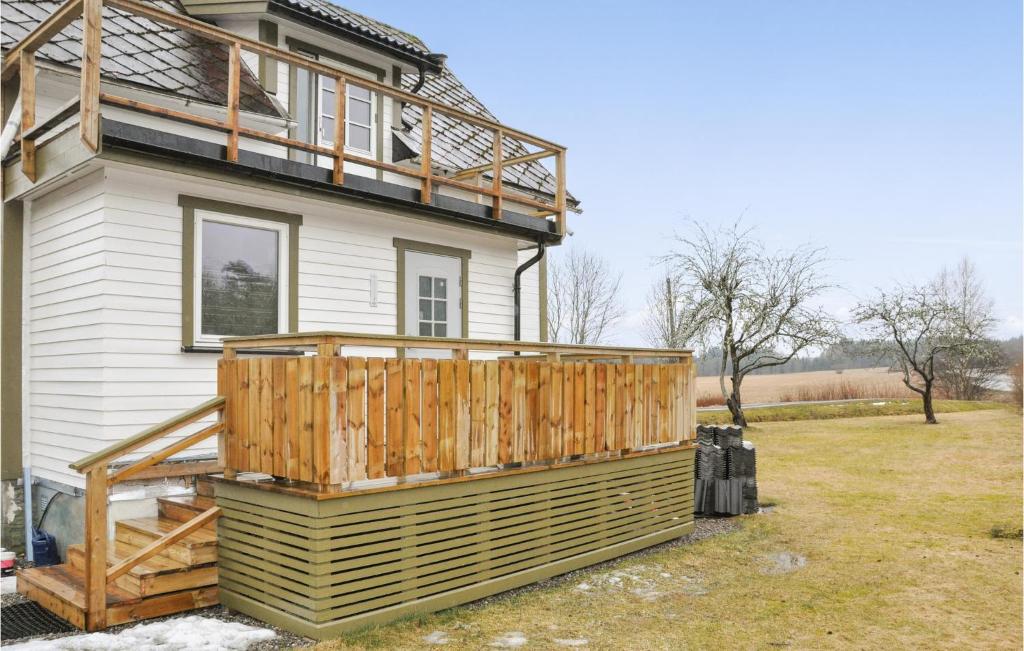 a house being constructed with a deck on the side of it at Stunning Home In Ed With Kitchen in Ed