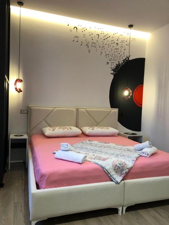 Postel nebo postele na pokoji v ubytování apartamente Melodi