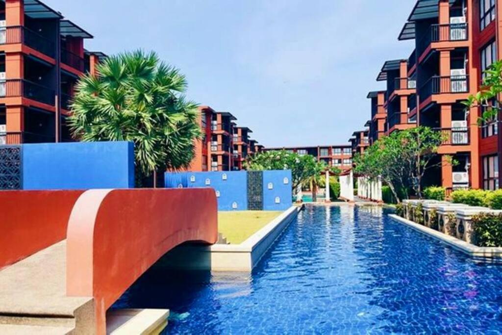 a canal in the middle of a city with buildings at Mountain View resort-style Condominium in Hua Hin