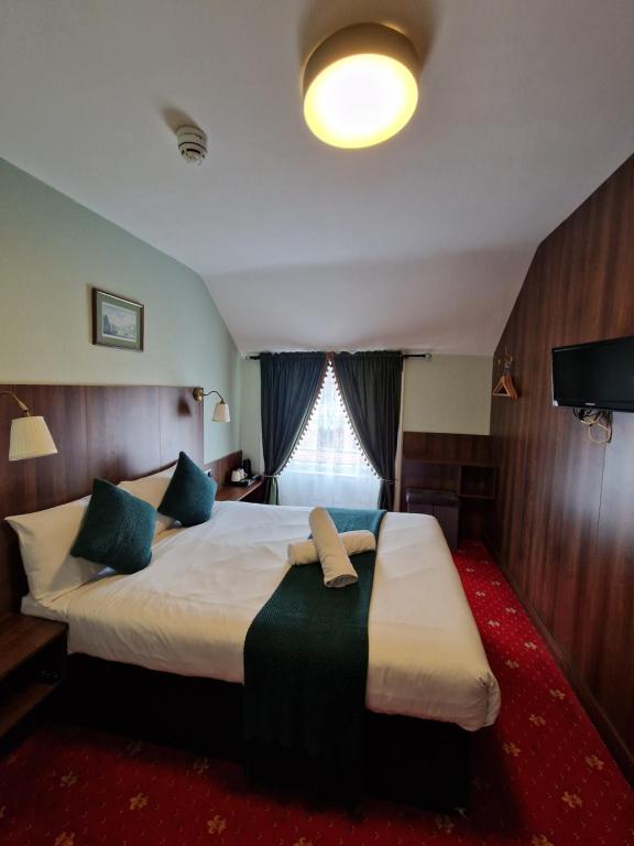 Postel nebo postele na pokoji v ubytování Lyndon Guesthouse