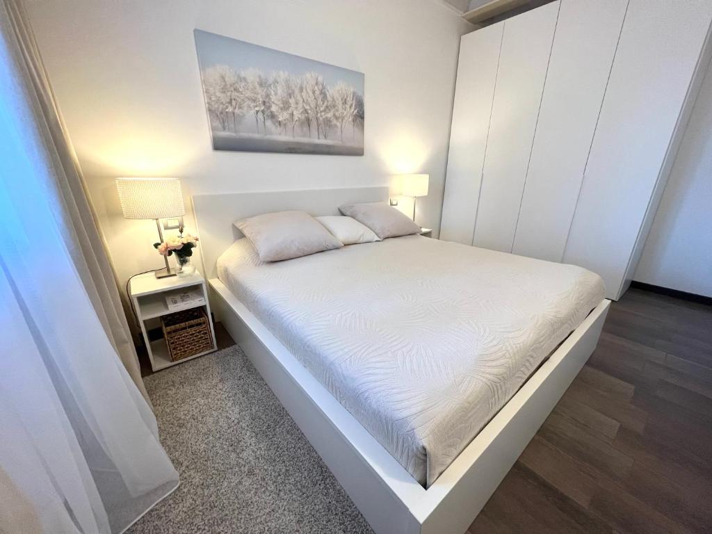 A bed or beds in a room at PAGANINI suites and apartments