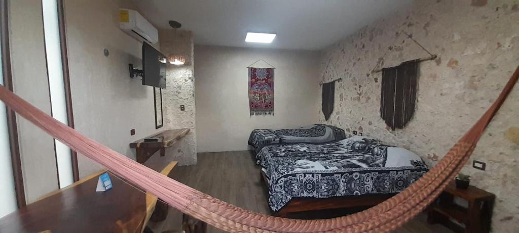 Postel nebo postele na pokoji v ubytování Casa los Jarochos