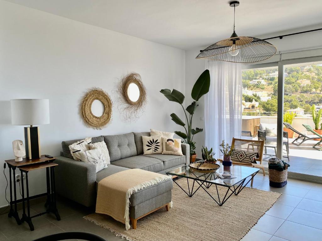 a living room with a couch and a table at Coastal Hills in Altea