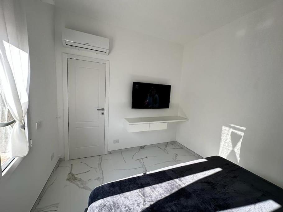 A television and/or entertainment centre at [Suite Aurora] Luxury in the center of Sanremo