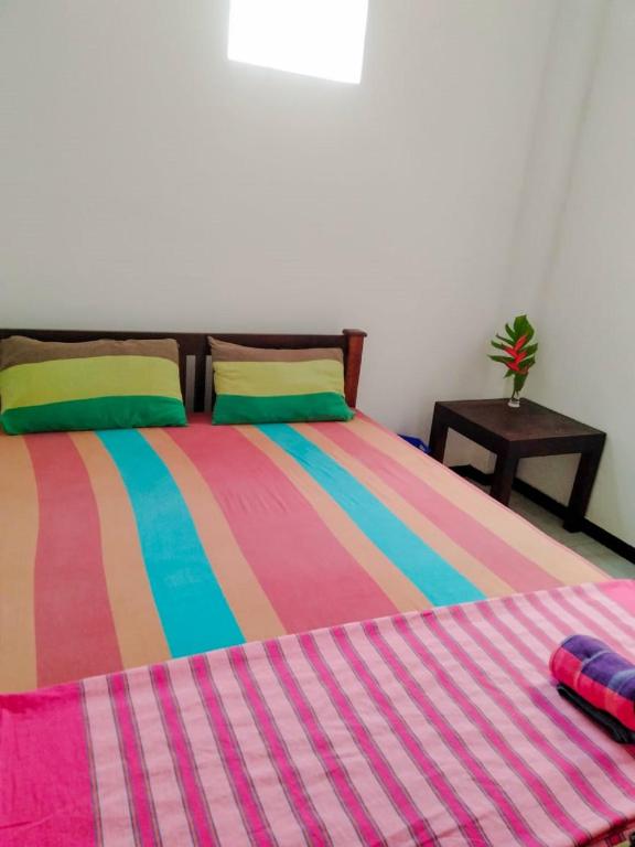 Postel nebo postele na pokoji v ubytování Backpacker Galle Hostel