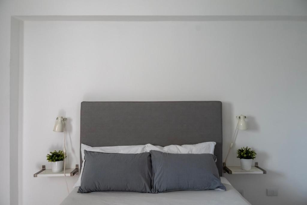 Postel nebo postele na pokoji v ubytování Palmer Suites
