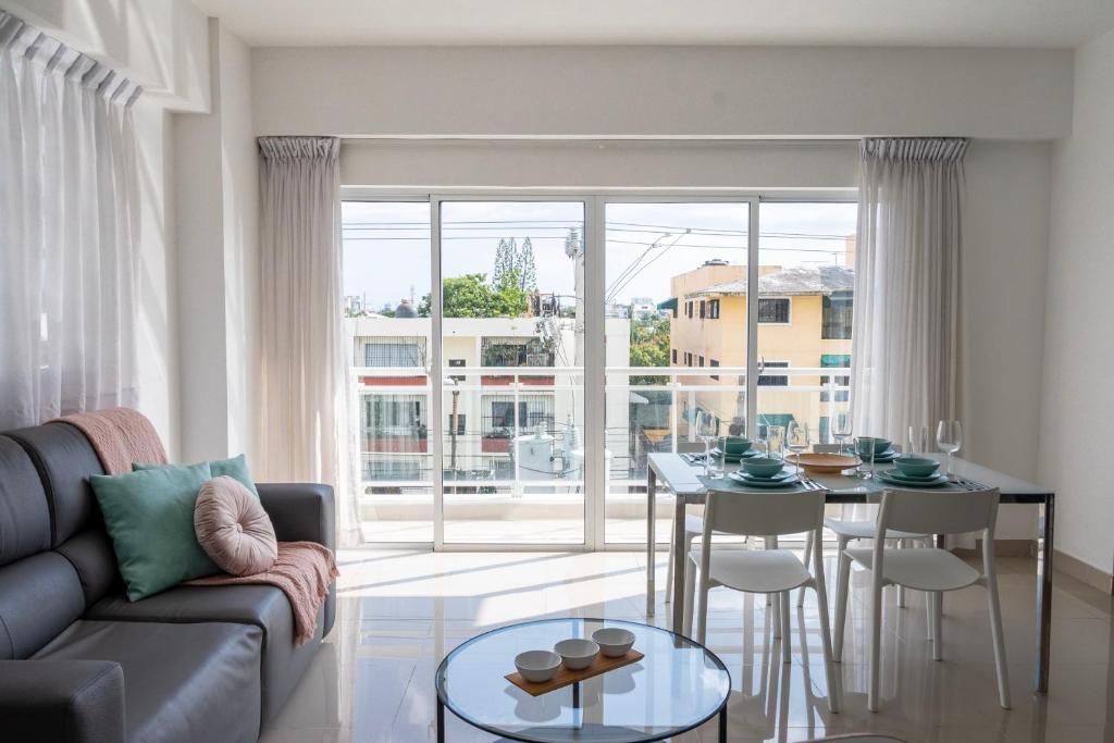 a living room with a couch and a table at Palmer Suites in Los Prados