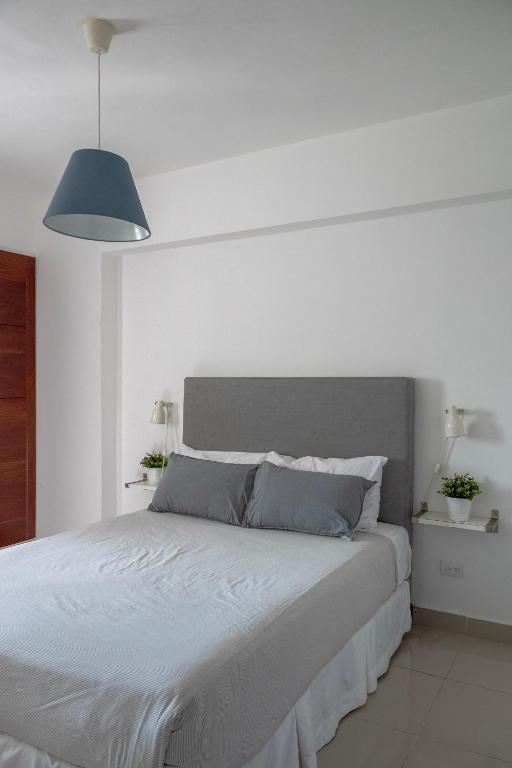 Postel nebo postele na pokoji v ubytování Palmer Suites