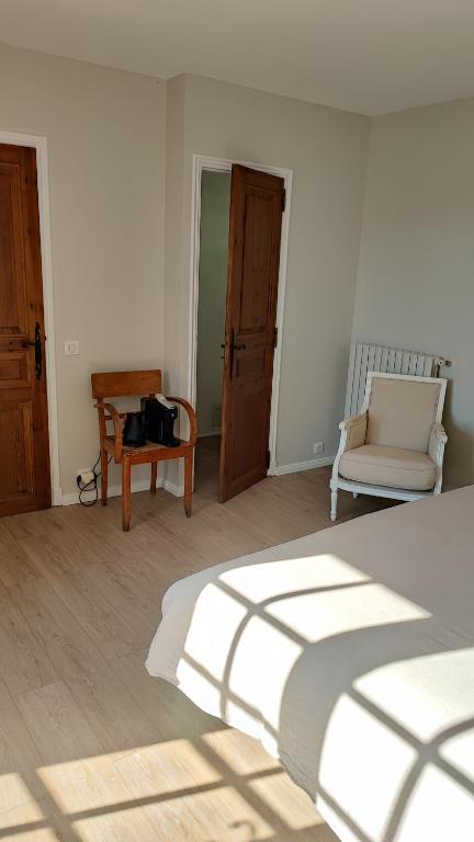 Postel nebo postele na pokoji v ubytování Le Mas Mélusine