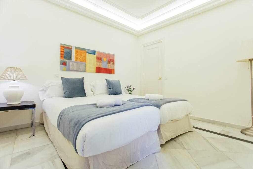 Posteľ alebo postele v izbe v ubytovaní Apartamento Boutique Abades