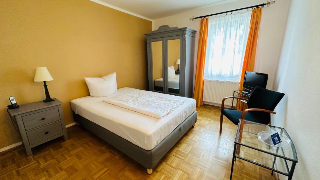 Postel nebo postele na pokoji v ubytování Hotel Erbgericht