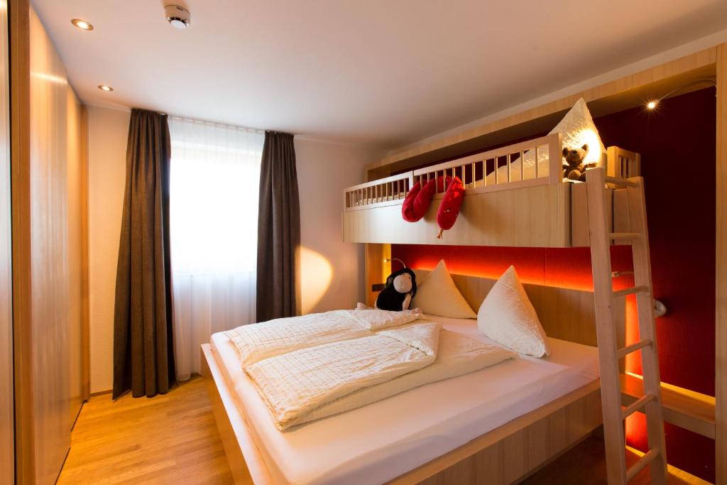 Postel nebo postele na pokoji v ubytování Almhotel Hochhäderich