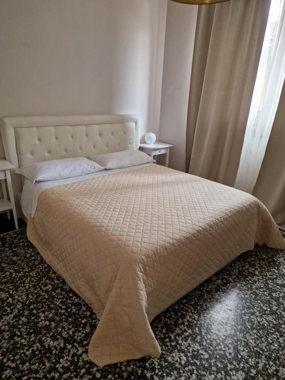 Postel nebo postele na pokoji v ubytování Le logge