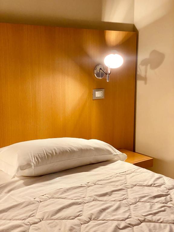 Postel nebo postele na pokoji v ubytování Hotel Saraceno Al Faro