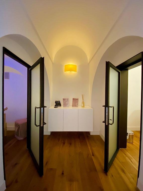 Postel nebo postele na pokoji v ubytování Hotel Saraceno Al Faro