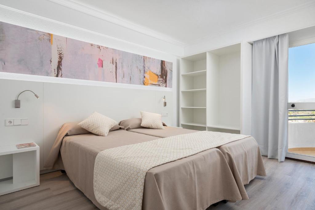 Postel nebo postele na pokoji v ubytování Alcudia Beach Apartments