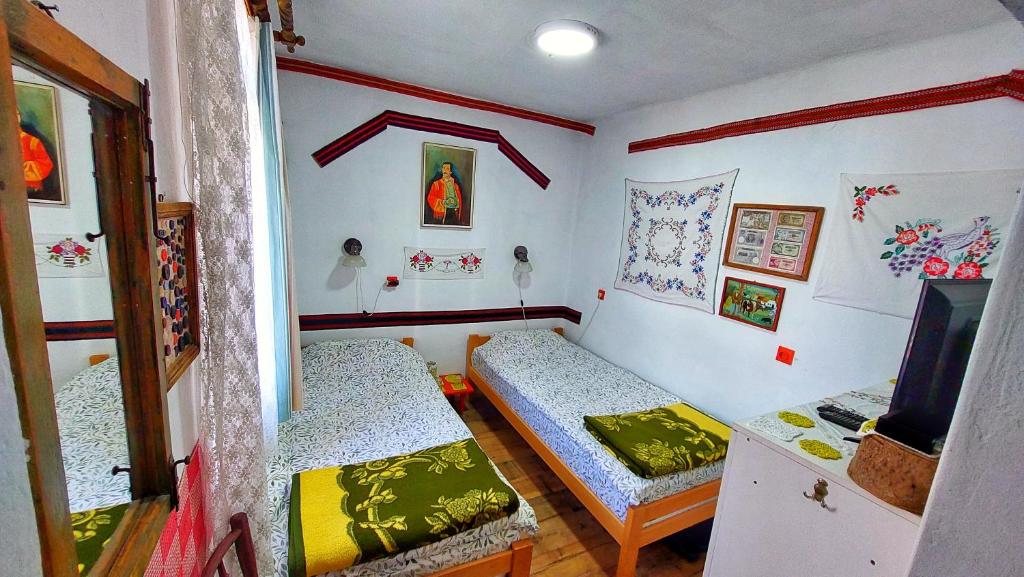 Postel nebo postele na pokoji v ubytování Vila Milenovic Rajacke Pivnice