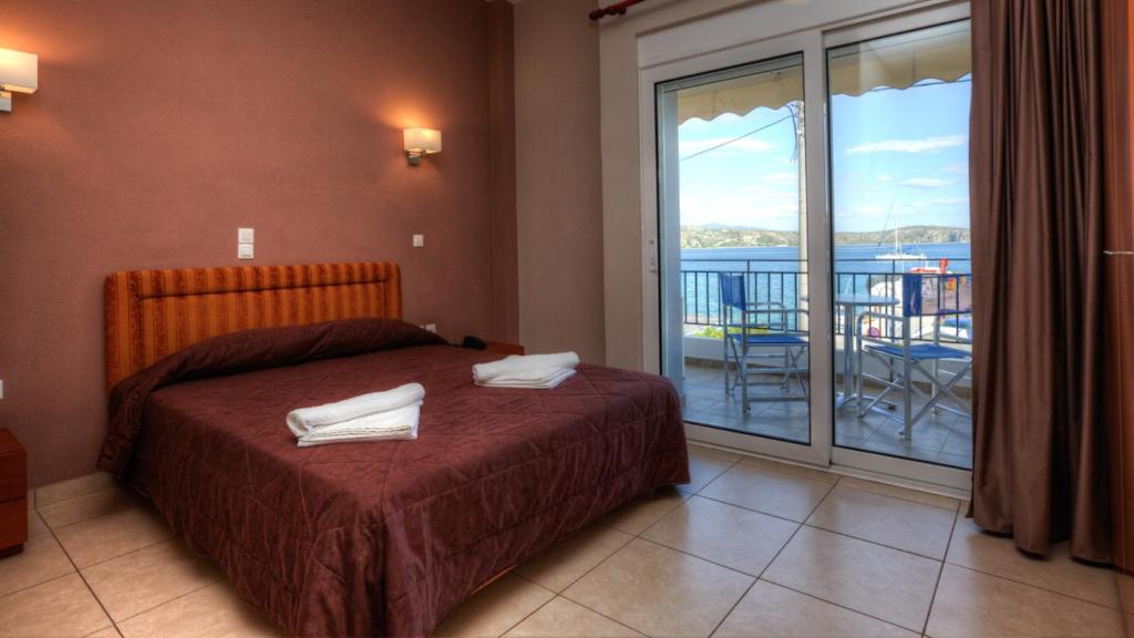 Postel nebo postele na pokoji v ubytování Hotel Apanema