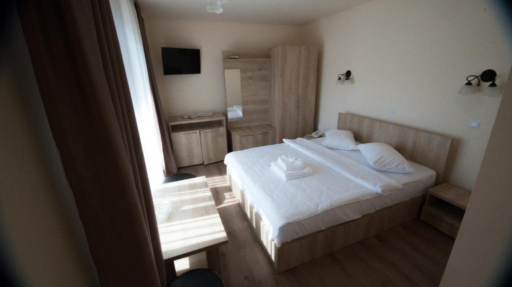 Postel nebo postele na pokoji v ubytování MELBA 3 flori cazanele Dunarii