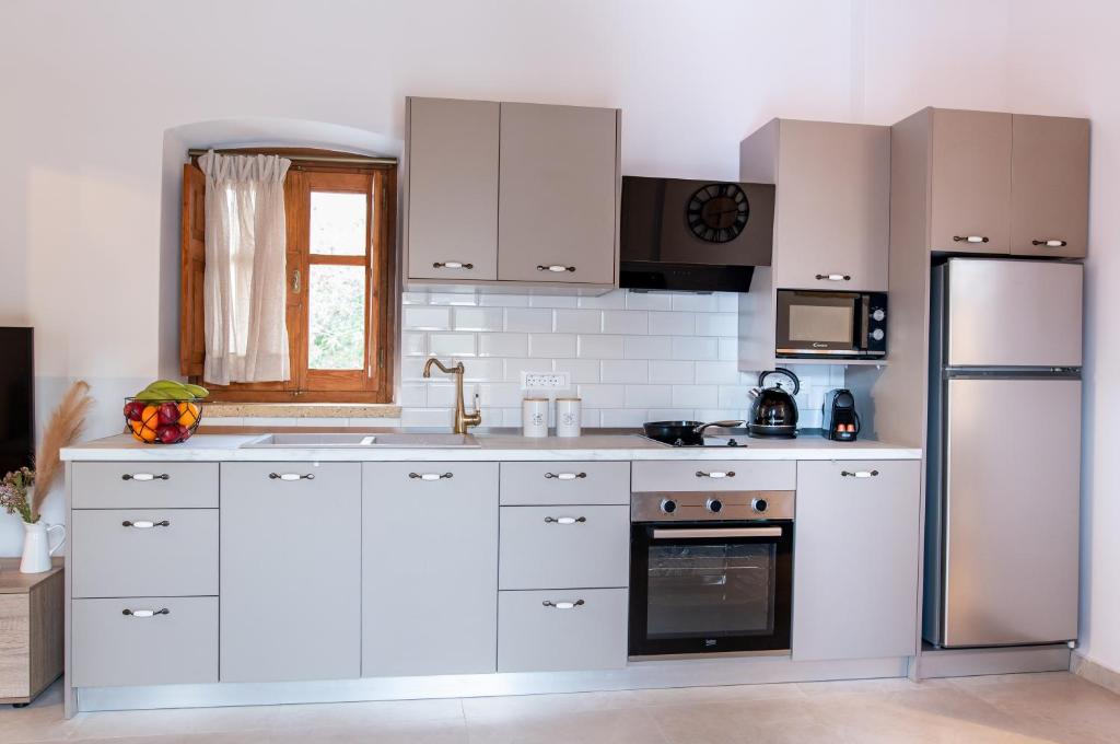 Kuchyň nebo kuchyňský kout v ubytování Paradisi Stone House