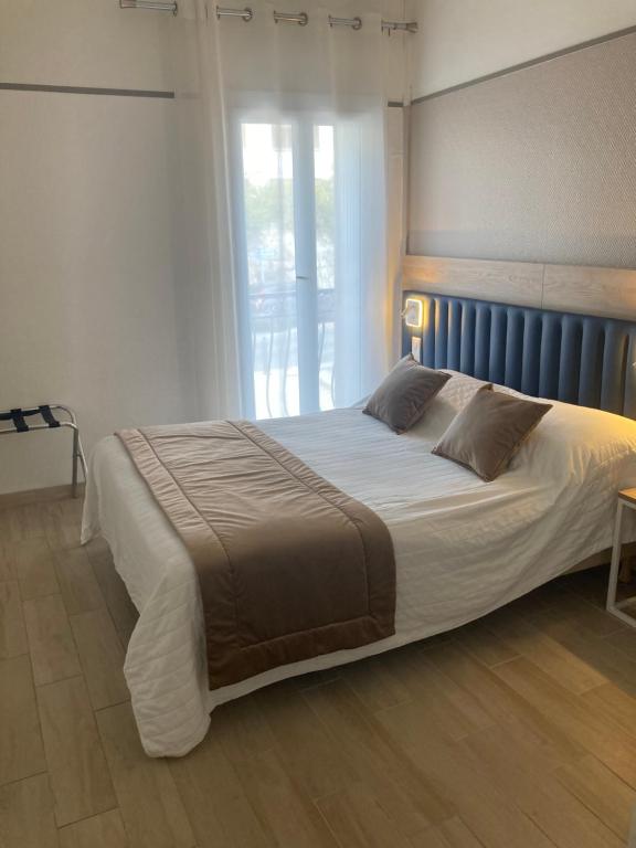 Postel nebo postele na pokoji v ubytování Hotel Le Golfe