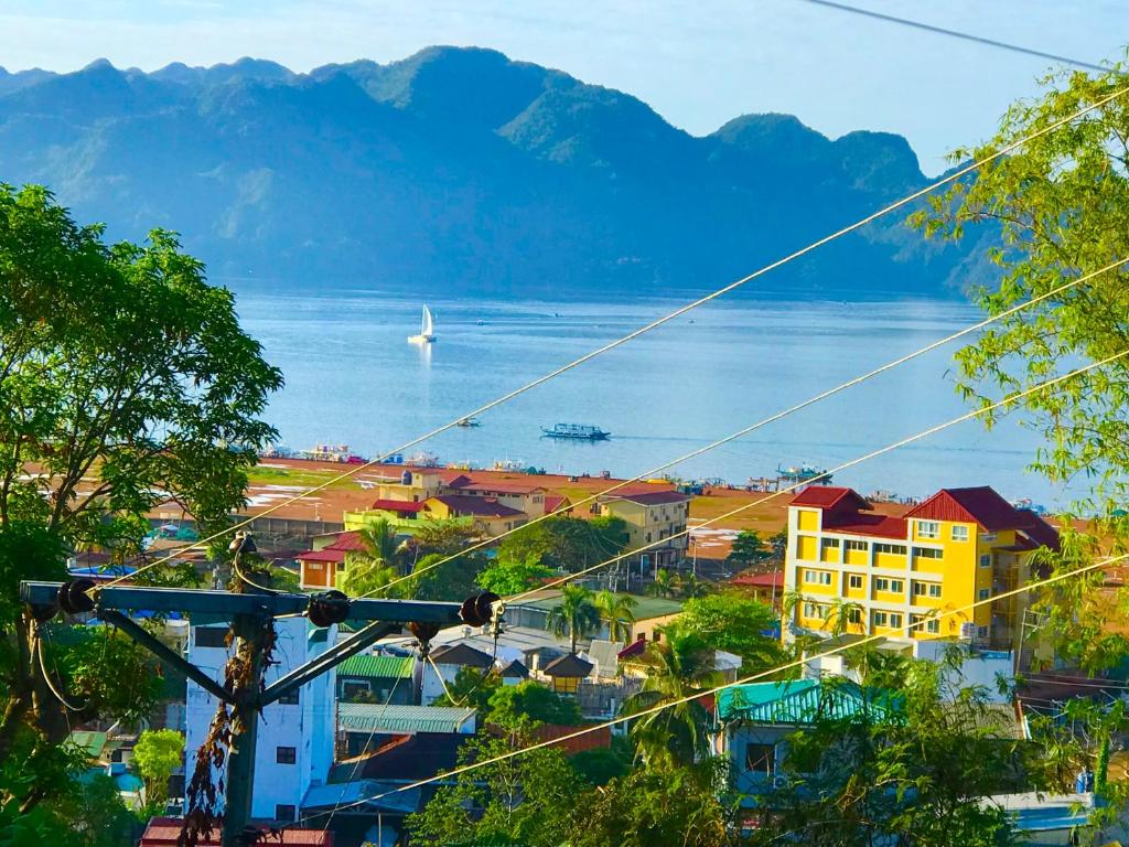 a city with a view of a body of water at Bayview Coron Kawa Resort in Coron