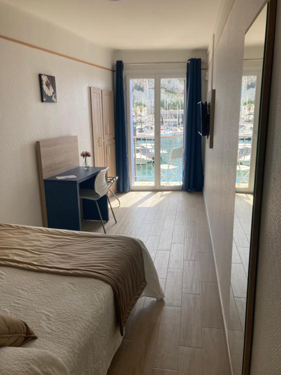 Postel nebo postele na pokoji v ubytování Hotel Le Golfe