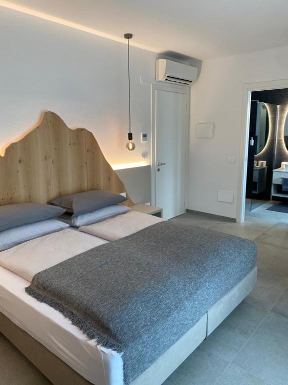 Säng eller sängar i ett rum på B&B Garda Home