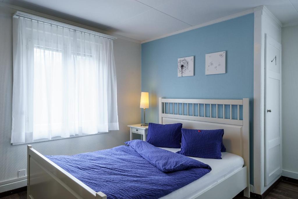 Uma cama ou camas num quarto em Hotel Alphorn