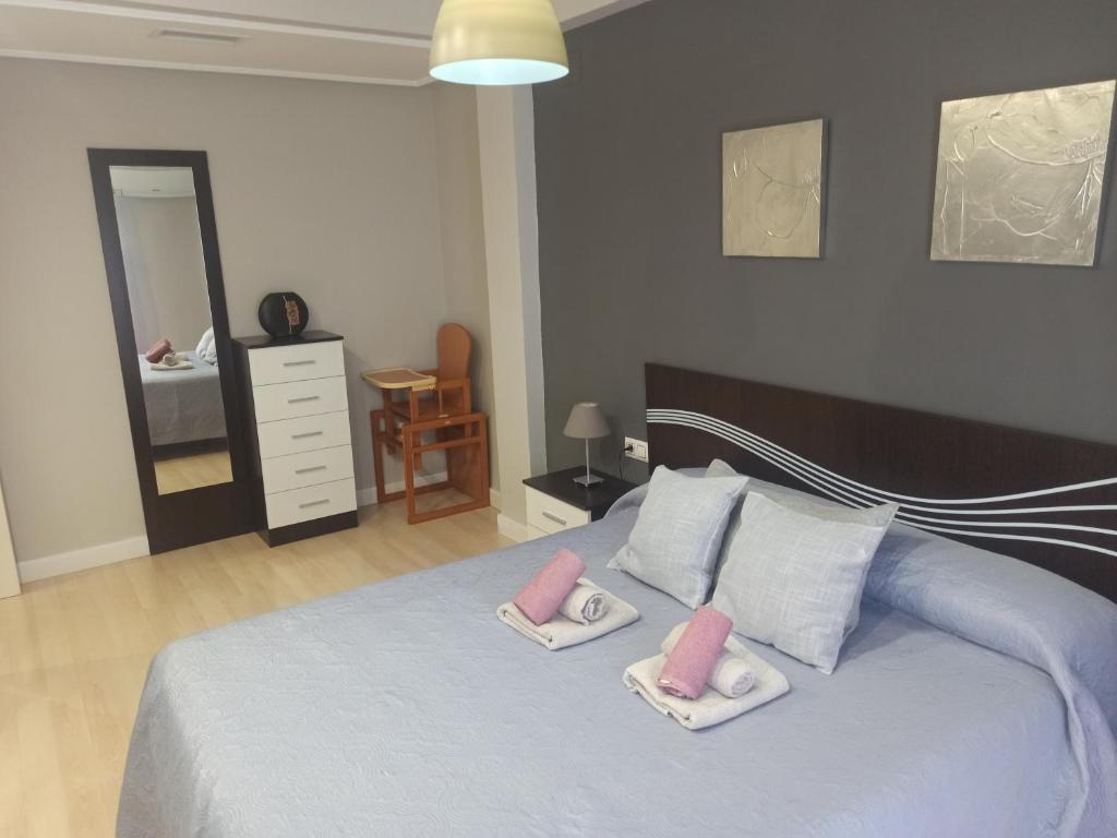 Posteľ alebo postele v izbe v ubytovaní Apartamento con parking privado gratis incluido