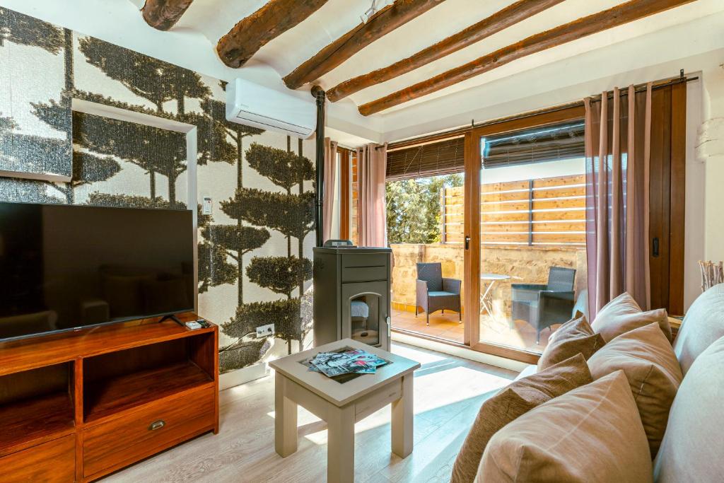TV a/nebo společenská místnost v ubytování Apartamentos Vino Tinto y Restaurante Tomate Rosa