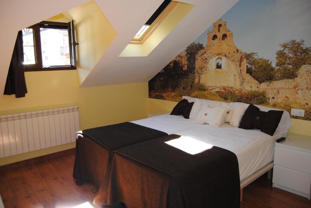 Postel nebo postele na pokoji v ubytování The Way Hotel Molinaseca