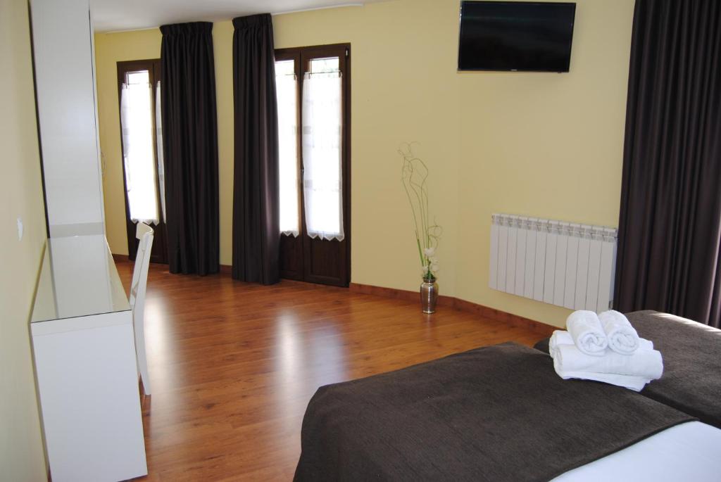 Postel nebo postele na pokoji v ubytování The Way Hotel Molinaseca