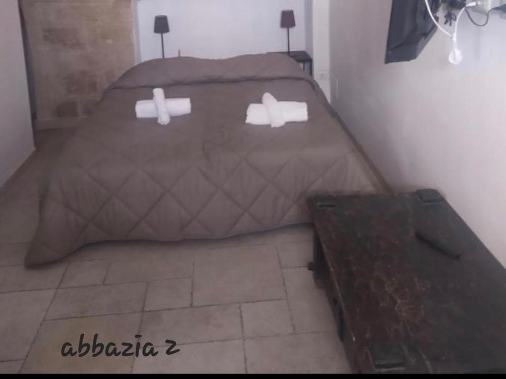 Łóżko lub łóżka w pokoju w obiekcie Abbazia Degli Svevi