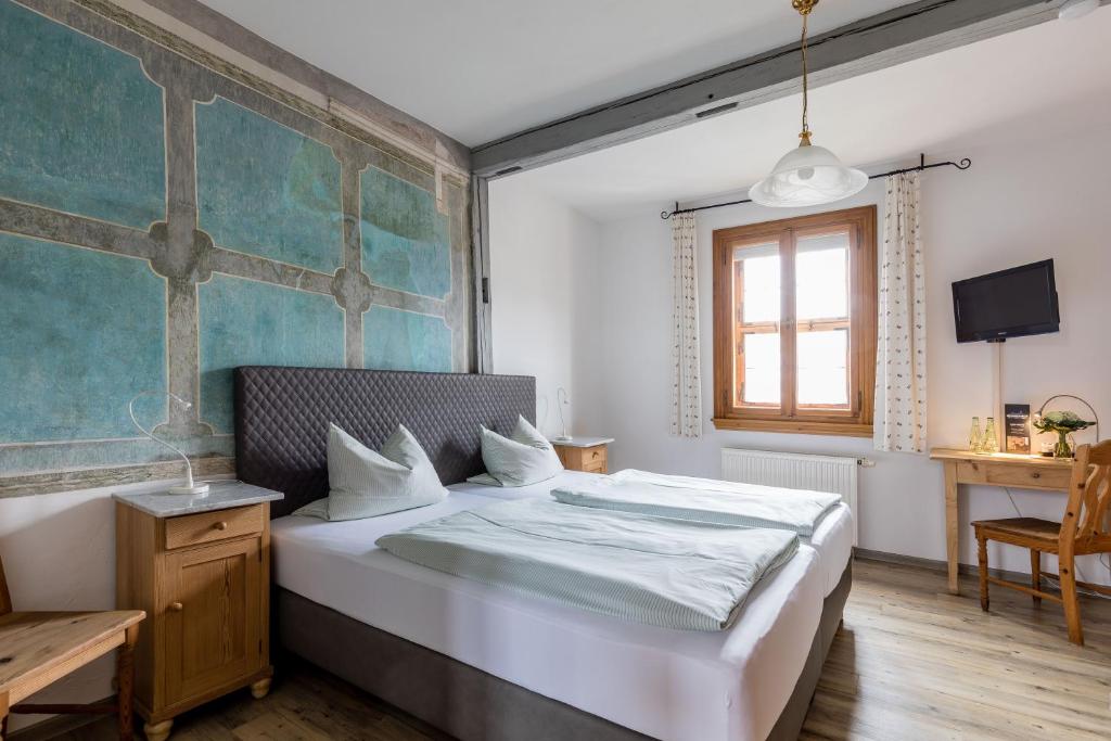 Postel nebo postele na pokoji v ubytování Hotel Meisnerhof