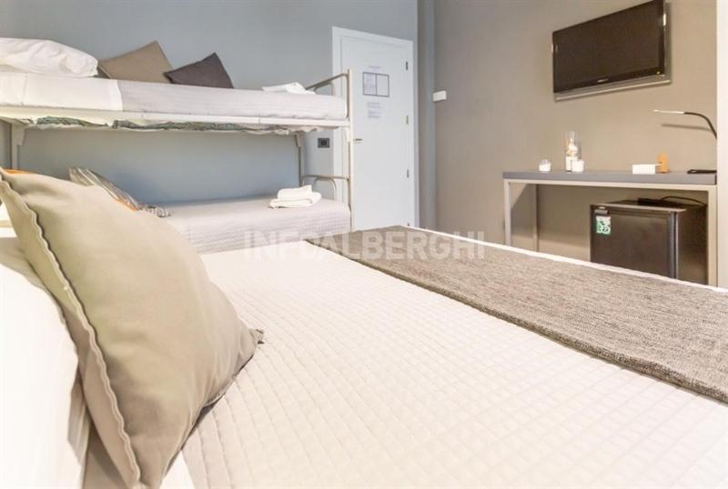 Postel nebo postele na pokoji v ubytování Albergo Aquila