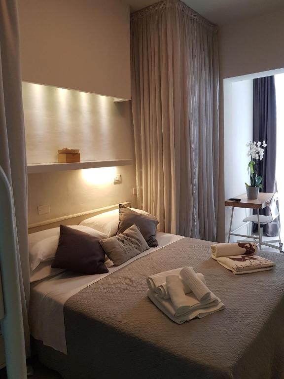 Postel nebo postele na pokoji v ubytování Albergo Aquila