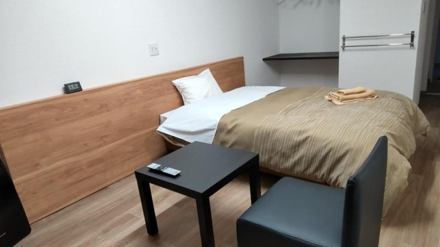 Postel nebo postele na pokoji v ubytování Basic Hotel Chichibu