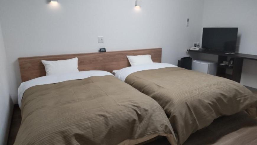 Postel nebo postele na pokoji v ubytování Basic Hotel Chichibu