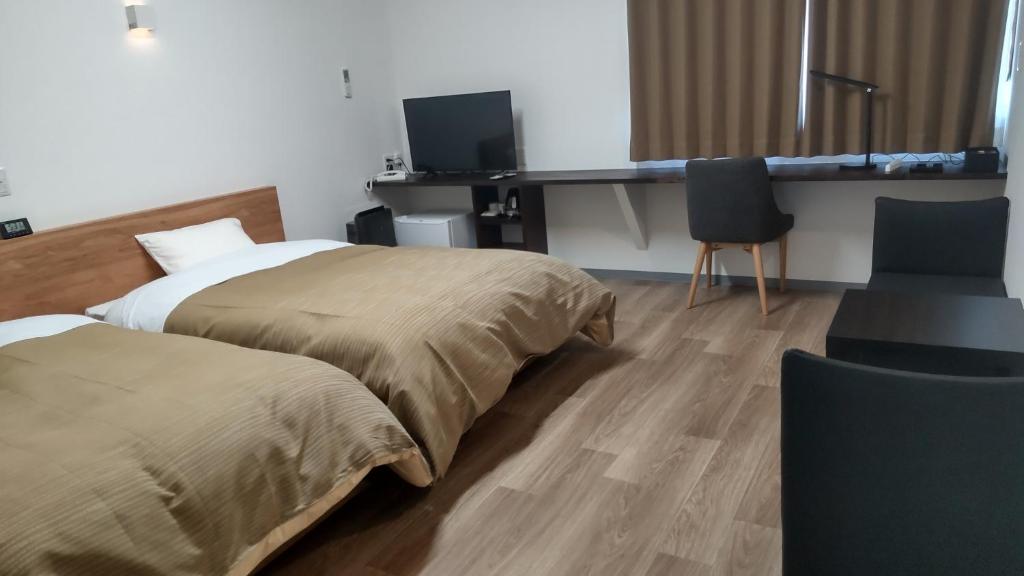 Postel nebo postele na pokoji v ubytování Basic Hotel Chichibu
