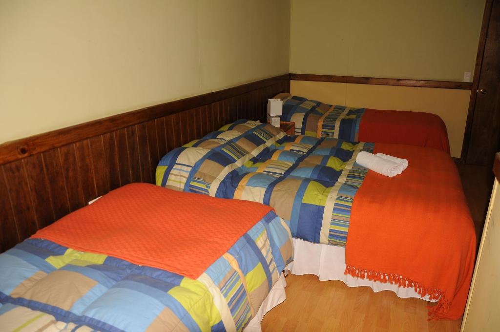 Uma cama ou camas num quarto em Hostal El Rincón
