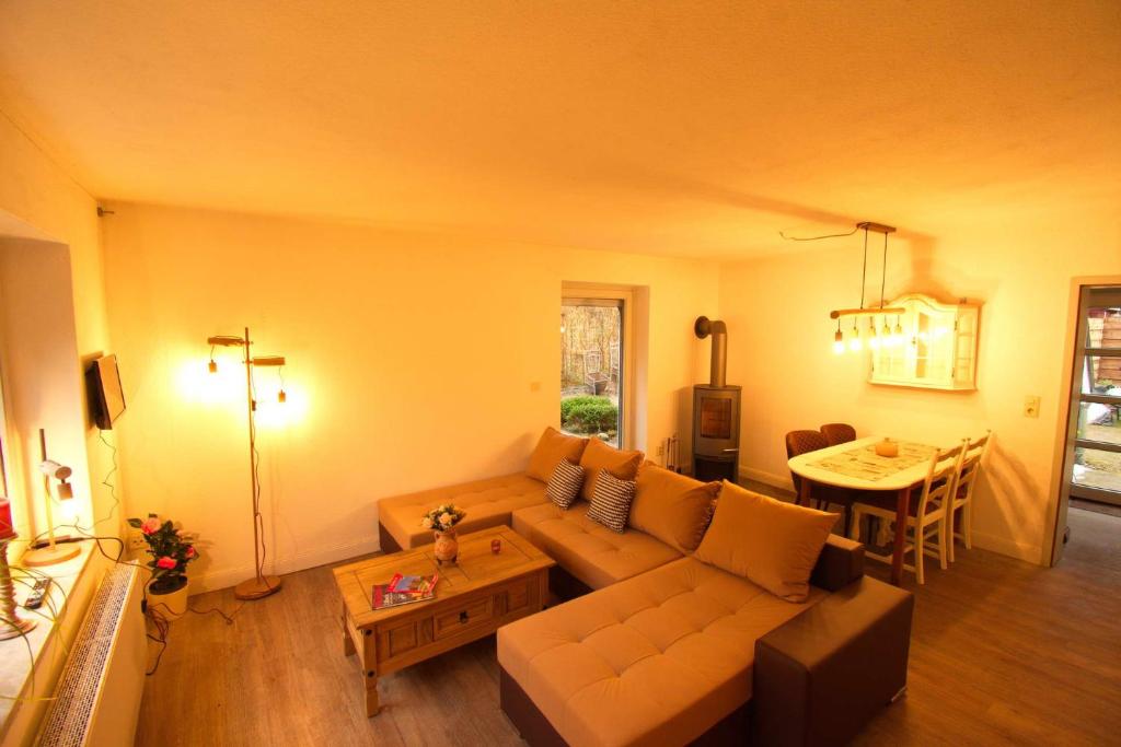 a living room with a couch and a table at Haus Maria in Ratzeburg