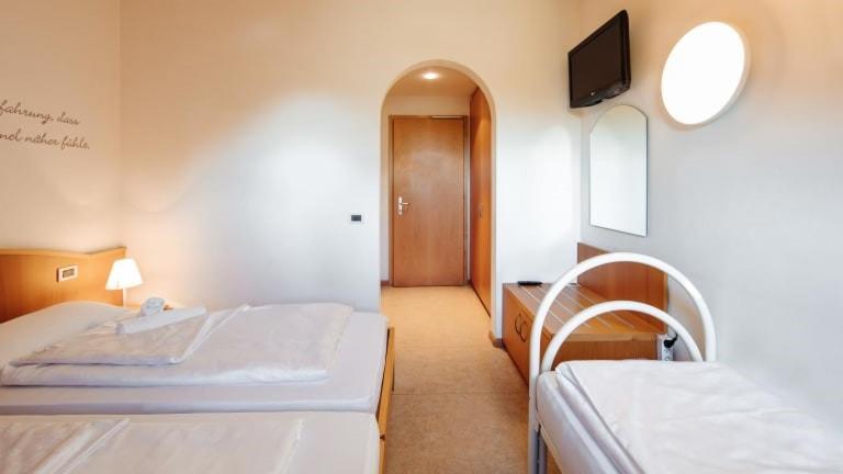 Letto o letti in una camera di Hotel Corno Bianco