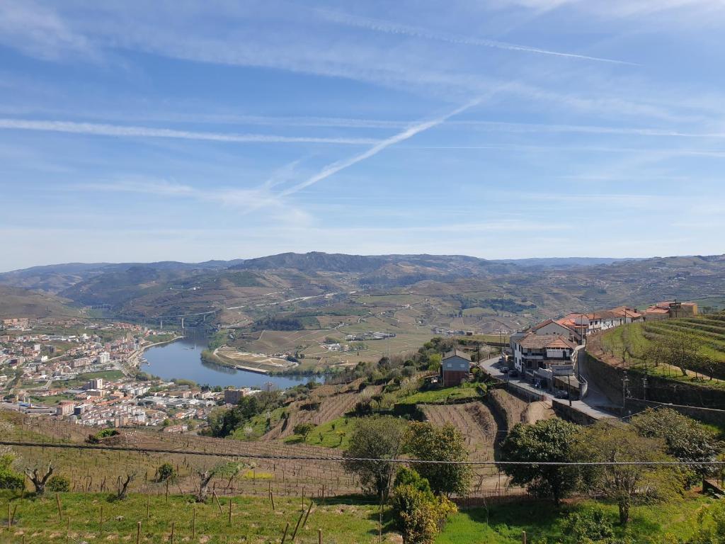 a view of a town and a river on a hill at Quinta de Sobre a Fonte Charming Apartments in Fontelas