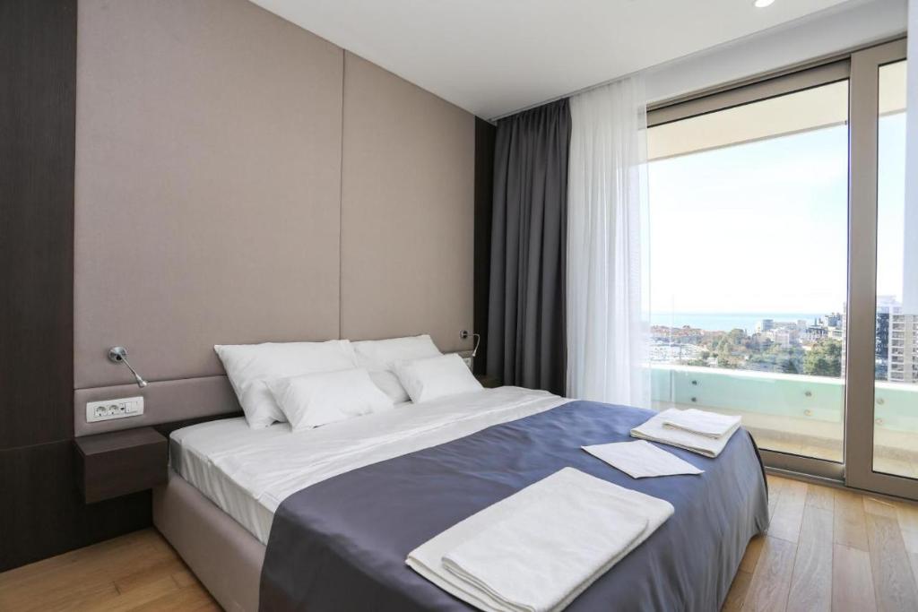 Postel nebo postele na pokoji v ubytování Apartments Lux