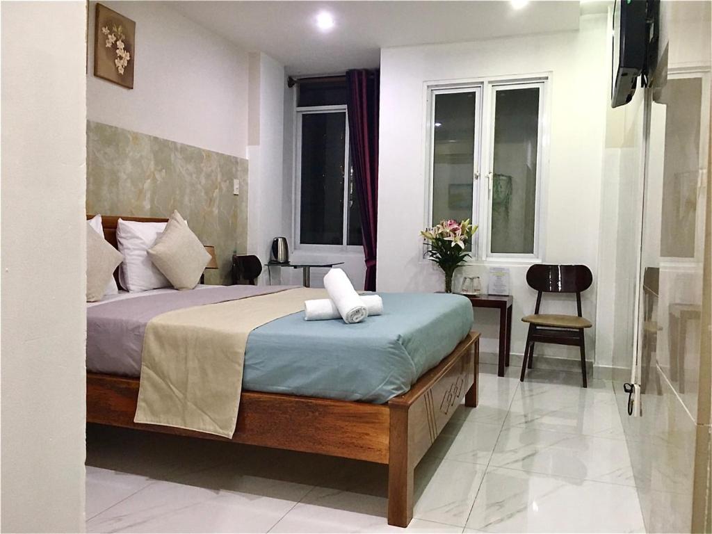 Saigon Cozy Hotel - Deluxe Room (2 Adults + 1 Child)