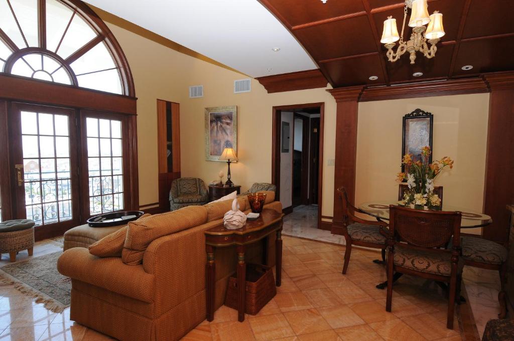 a living room with a couch and a table at The Flanders Hotel in Ocean City