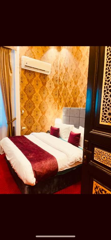 Postel nebo postele na pokoji v ubytování Cairo Inn